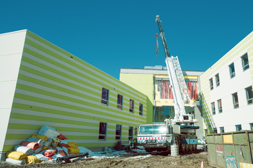 130-ton crane hoisting 16,000lb hvac unit