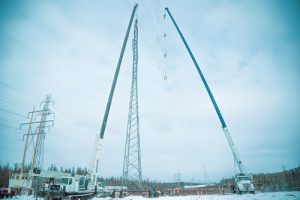 130 ton crane hoisting up powerline