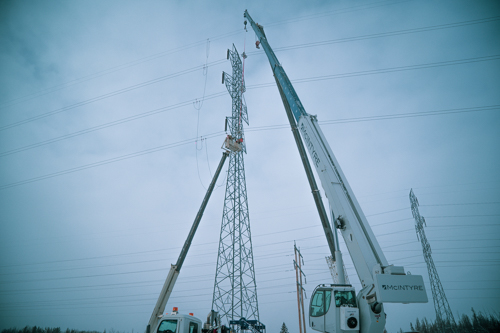 50 ton crane holding transmission lines